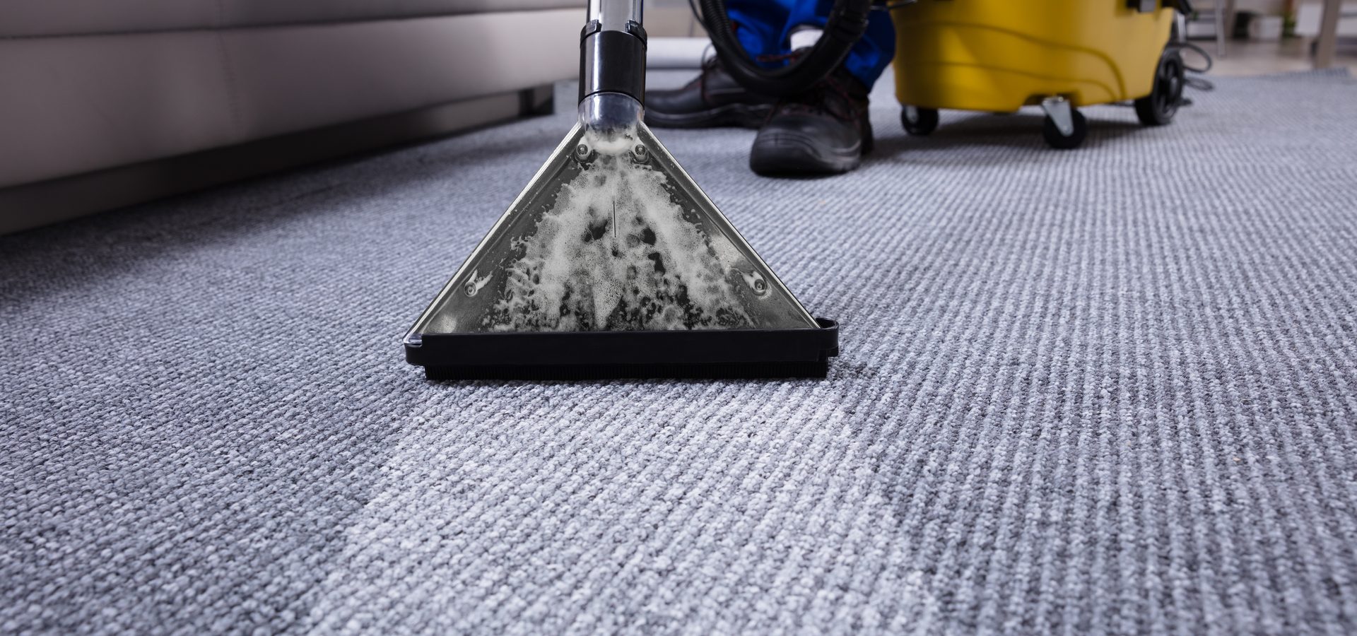 carpet cleaning machine being used to clean and office carpet
